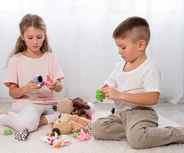 non-binary-kids-playing-together-indoors_23-2148779629